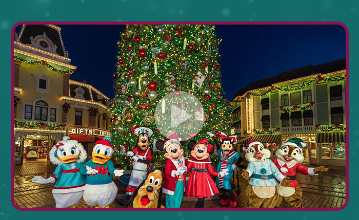 Disney Character in front of the Christmas Tree at Disneyland's Main Street