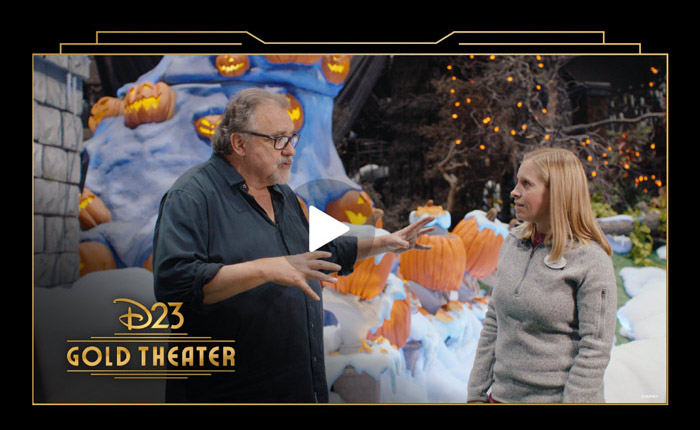 D23 Gold Theater video thumbnail featuring Don Hahn speaking with a Disney Cast Member among Halloween pumpkins.