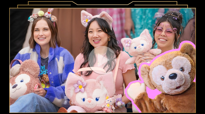 Three women in Duffy & Friends gear—animal-ear headbands and plushies of Duffy, LinaBell and StellaLou—smile for a photo.