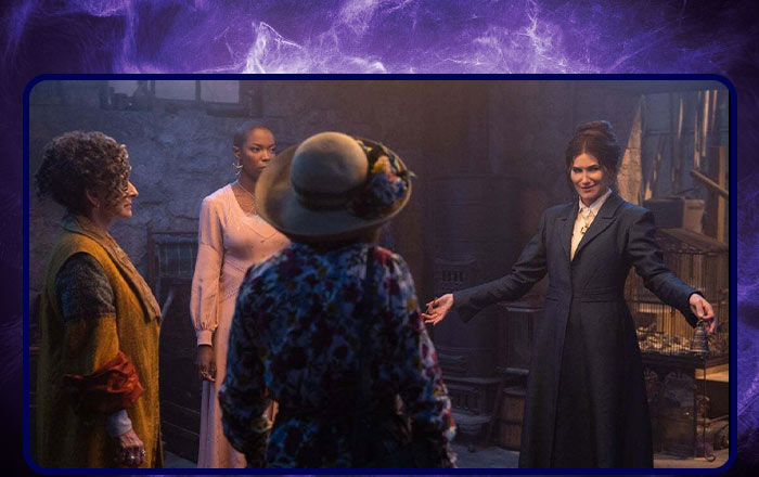 Lilia Calderu (Patti LuPone), Jennifer Kale (Sasheer Zamata), Mrs. Hart/Sharon Davis (Debra Jo Rupp), and Agatha Harkness (Kathryn Hahn) are gathered in a stone-walled basement.