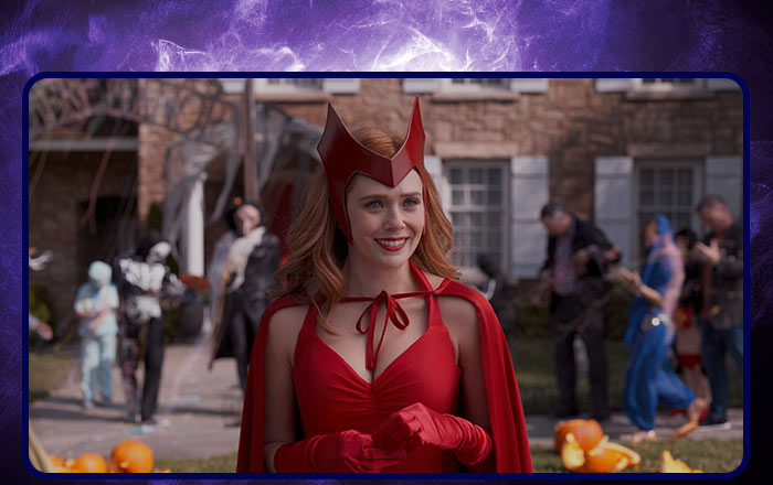 Image of a witch trick or treating in a  red dress