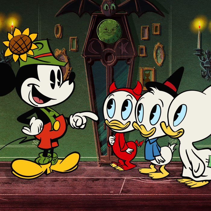 An image of Mickey Mouse talking to Huey, Dewey and Louie whom are all dressed in Halloween Costumes.