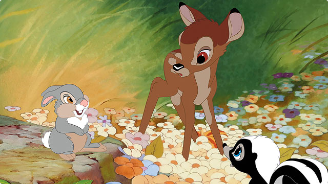 Bambi stands in meadow with Thumper and Flower in a scene from Disney's animated classic.