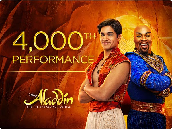 Aladdin on Broadway marks its 4,000th performance; Aladdin and Genie actors pose back-to-back.