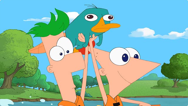 Phineas and Fern cheer as they hoist Perry the Platypus during a sunny park adventure.