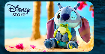 Disney store promo: Winking Stitch plush hugs a frog toy on a sunny beach, “Disney Store”