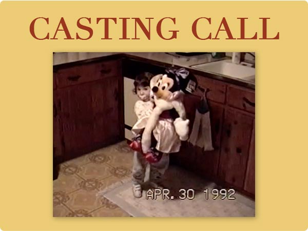 CASTING CALL above VHS-style photo of young child hugging large Goofy plush in a 1990s kitchen; timestamp reads “APR. 30 1992”.