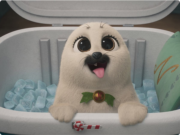 Adorable animated white seal pup with big eyes and holly collar sitting in cooler filled with ice.