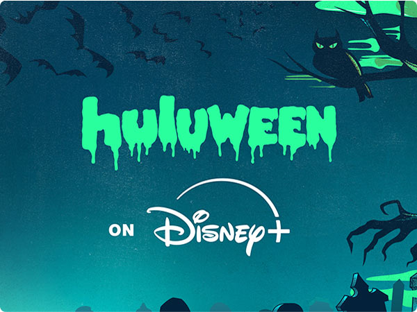 Huluween on Disney Plus with glowing green text, bats, and spooky tree silhouette.
