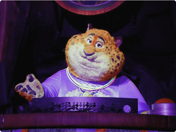 DJing under purple lights: Animated Benjamin Clawhauser Audio-Animatronics figure for the Zootopia: Better Zoogether! show at Disney’s Animal Kingdom Theme Park.
