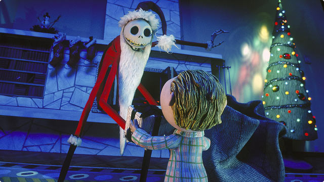 Jack Skellington dressed as Sandy Claws greets a child in pajamas before a Christmas tree in The Nightmare Before Christmas.