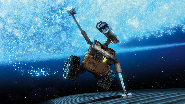 WALL-E floats above Earth, arm raised.
