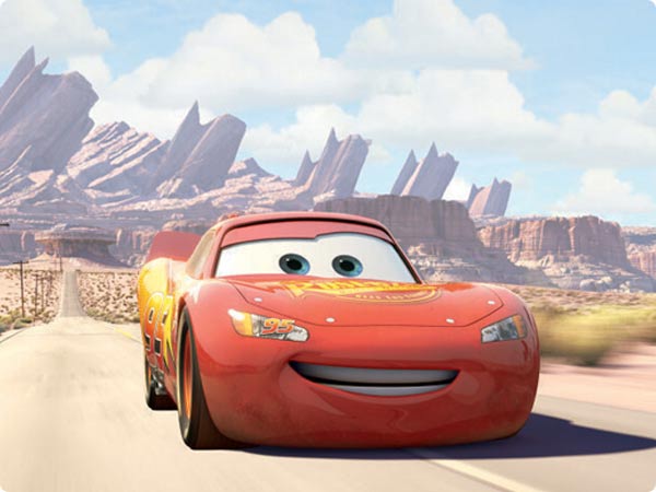Lighting McQueen speeding along radiator Springs highway.