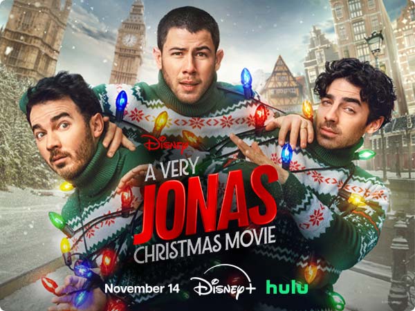 The Jonas Brothers wrapped in Christmas lights for Disney's “A Very Jonas Christmas Movie, “Streaming November 14 on Disney+ and Hulu.